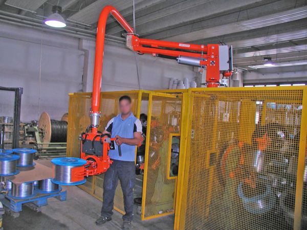 Rigid arms manipulator, pneumatic clamp to grip on external side of metallic wire bobbins.